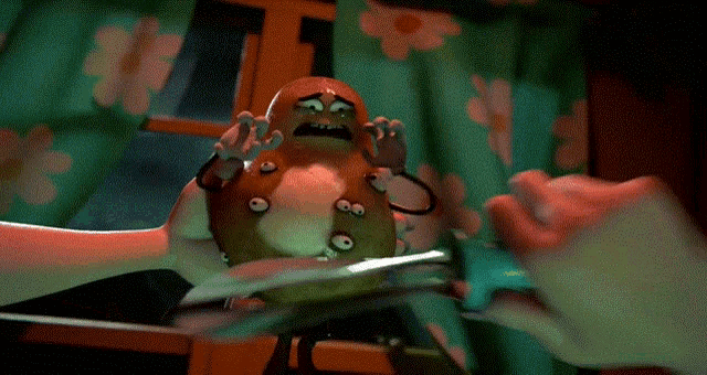 a person is holding a pear in their hands with a knife