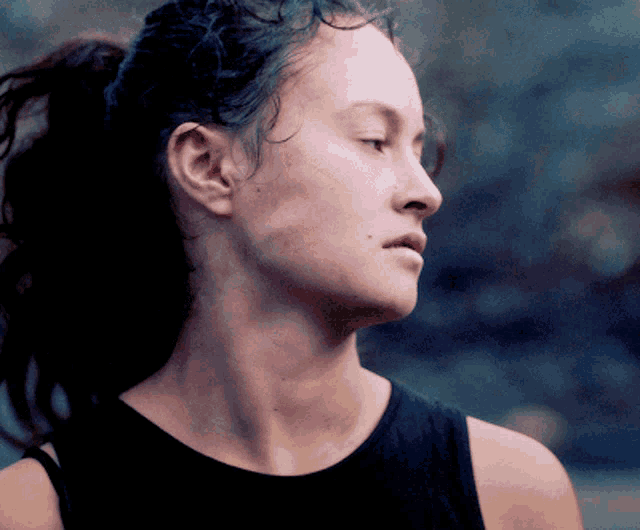 a close up of a woman 's face and neck