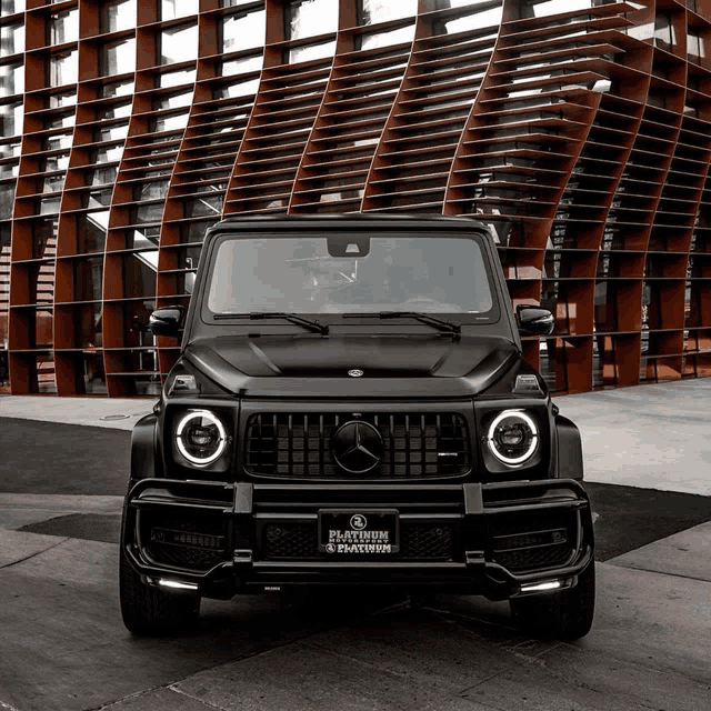 a black mercedes with a license plate that says blacktown on it