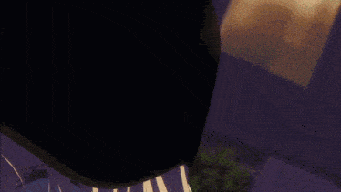 a close up of a cartoon character 's face with purple eyes