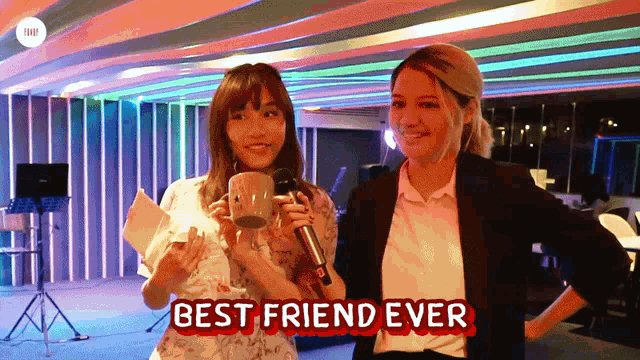 a woman holding a microphone next to another woman with the words best friend ever