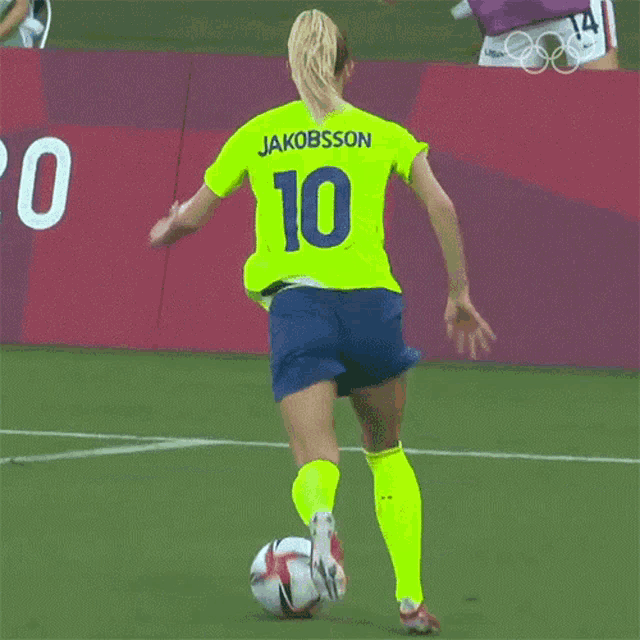 a soccer player wearing a yellow jersey with jakobsson on the back