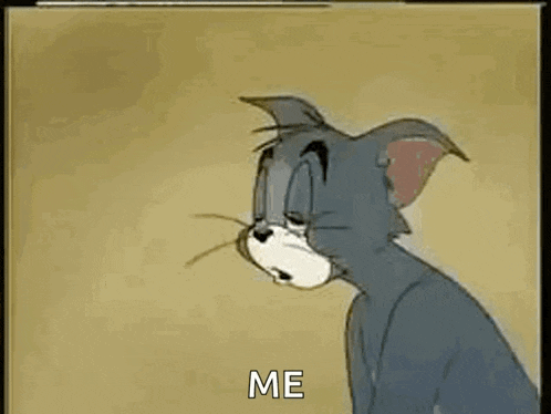 tom and jerry are playing a video game and tom is pressing a button .