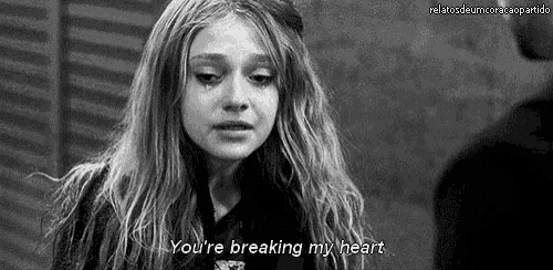 a woman is crying in a black and white photo and says `` you 're breaking my heart '' .