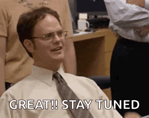 a man in a white shirt and tie is sitting in a chair and smiling while saying `` great ! stay tuned '' .