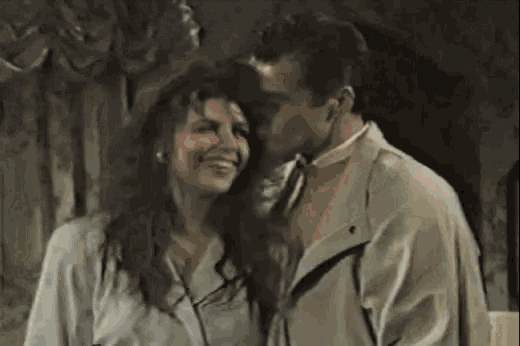 a man and a woman are dancing together in a room .