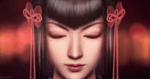 a close up of a girl 's face with her eyes closed .