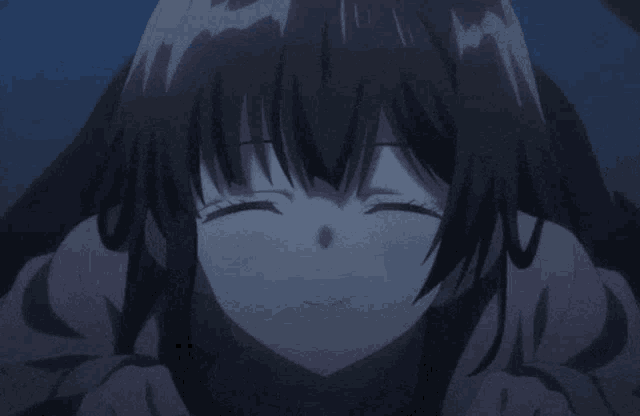a close up of a girl with her eyes closed smiling