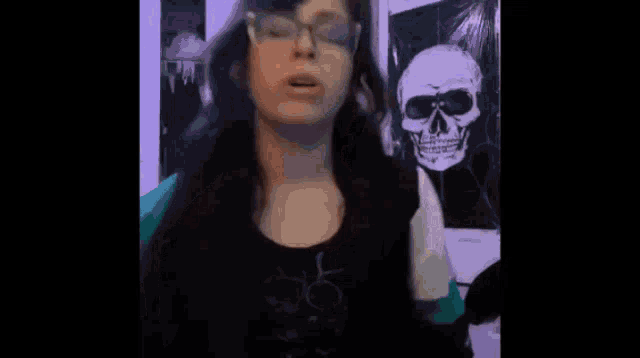 a person is kneeling down holding a book that says death note on it