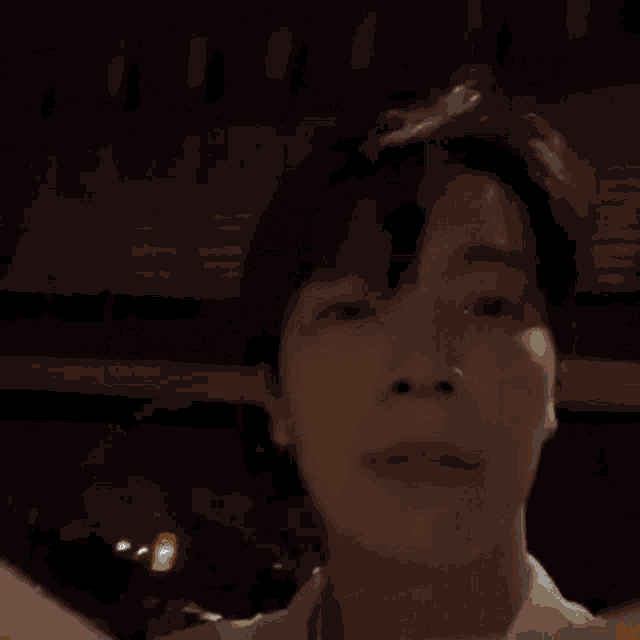 a close up of a person 's face with a blurry background