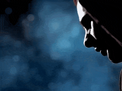 a silhouette of a man 's face with a blue background
