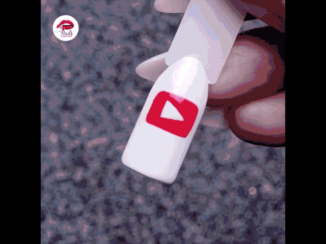 a person is holding a nail with a youtube icon on it