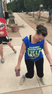 a woman wearing a blue shirt that says ' clarksville ' on it