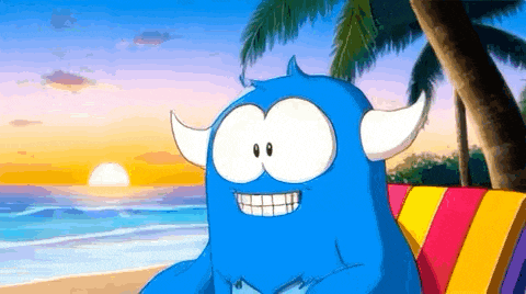 a blue cartoon monster with horns is sitting on a beach blanket .