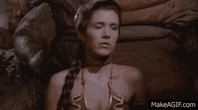 a woman in a braided ponytail is sitting on a throne with a statue of a man behind her