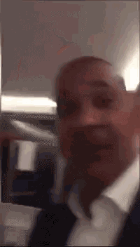 a blurry picture of a man in a suit and tie