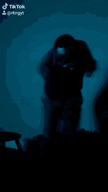 a blurry picture of a person with a mask on taken by tik tok