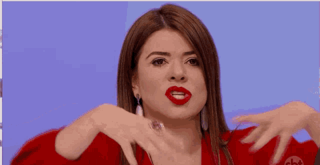 a woman wearing red lipstick and earrings with the word cbt on the bottom