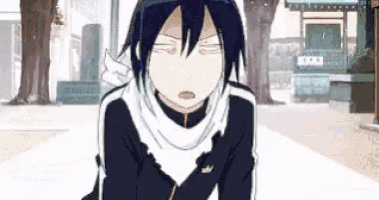 a cartoon character with a scarf around his neck is sitting on the ground with his eyes closed .
