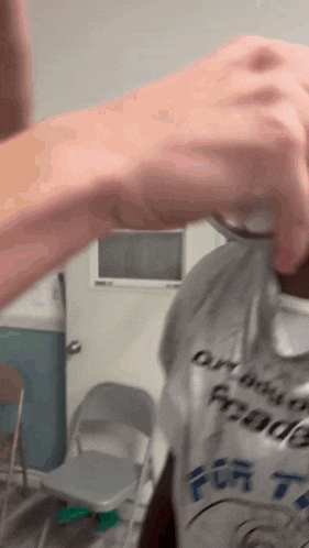 a person wearing a shirt that says ' dry bits ' on it