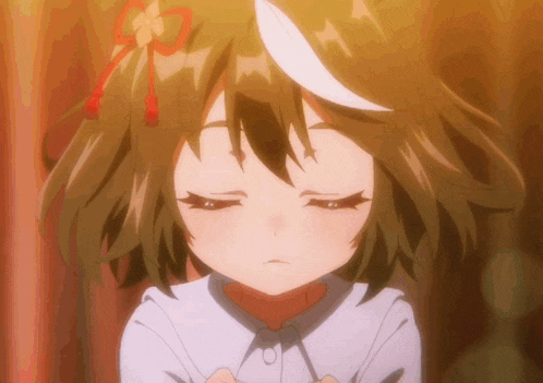 a close up of a girl 's face with a white tail on her head