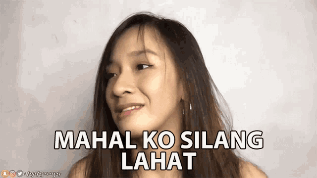 a woman with long hair says mahal ko silang lahat on her face