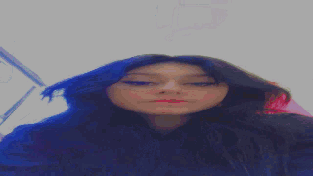 a blurred image of a person 's face with the letter s on it