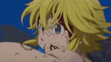 a close up of a person 's face with blood coming out of it 's mouth .