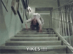 a woman is doing a handstand on a set of stairs and says yikes .