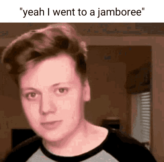 a young man says " yeah i went to a jamboree " in front of a brown background
