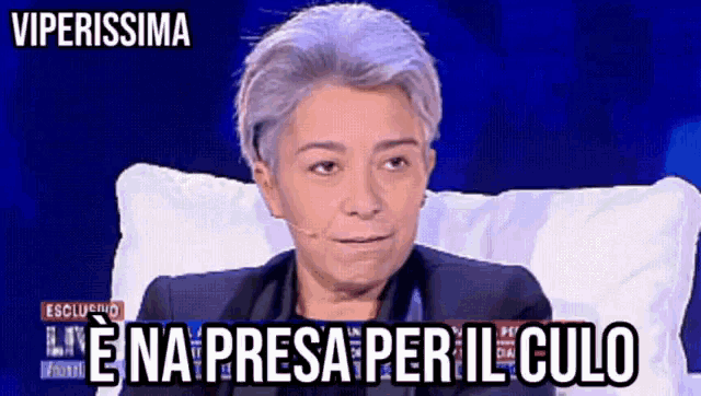 a woman is sitting in a chair with the words viperissima written above her