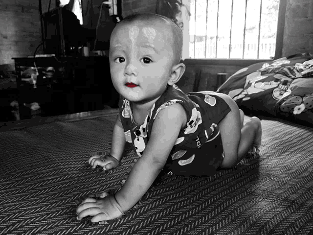 a baby wearing a shirt that says ' i 'm a ' on it