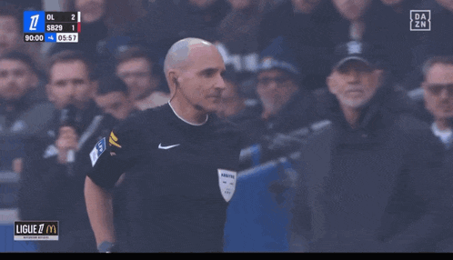 a soccer game is being played and the score is 1 to 2