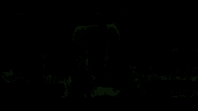 a man wearing a cowboy hat is standing in front of a body of water .