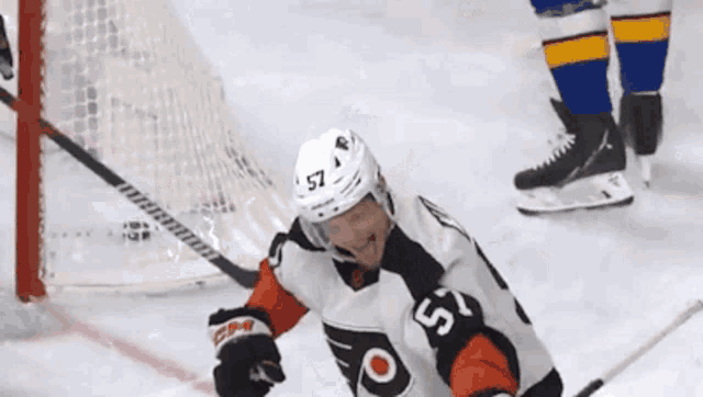 a hockey player with the number 57 on his shirt