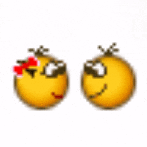 two smiley faces are kissing each other on the cheek .