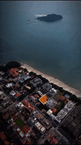 an aerial view of a city with a small island in the distance and the words intercom at the top