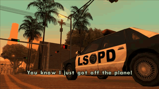 a lsopd police car is driving down the street