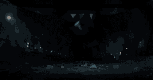 a person is flying through the air in a dark room .