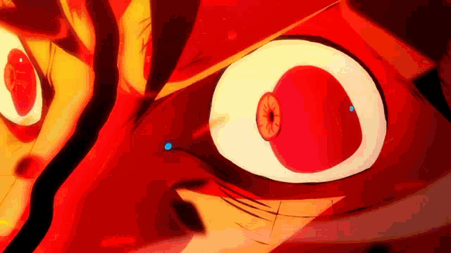 a close up of a cartoon character 's eyes with a red eye and a white eye .