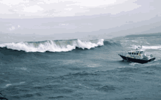a small boat in the middle of a large body of water with waves