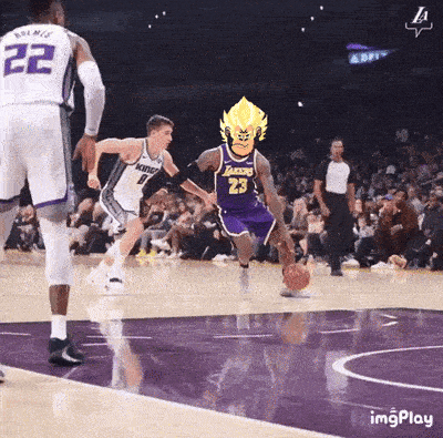a basketball player with the number 23 on his jersey is dribbling a basketball