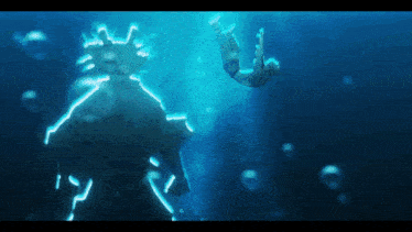 a person is falling into a body of water with a glowing statue in the background