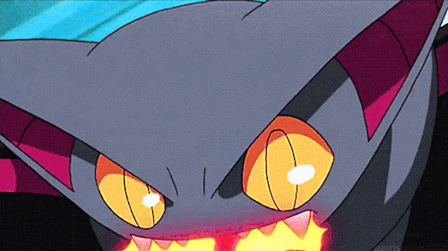 a close up of a cartoon character 's face with orange eyes and teeth
