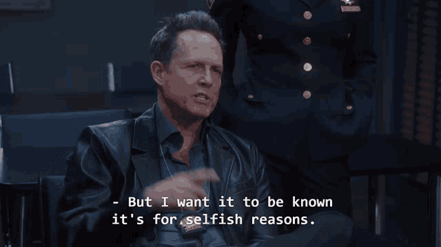 a man in a leather jacket is talking about selfish reasons