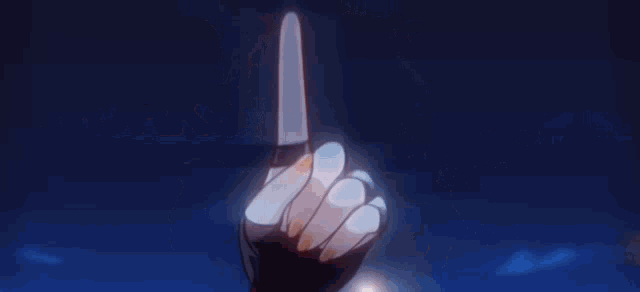 a close up of a girl 's face in a blurry anime scene with a blue background .