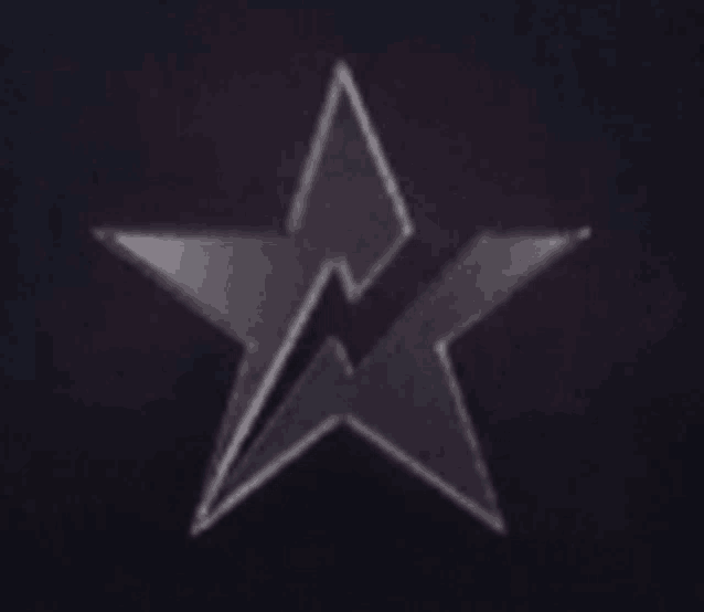 a black star with a lightning bolt in the middle on a dark background .
