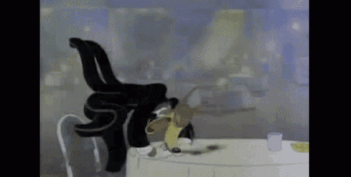 a cartoon cat is sitting at a table with a glass of beer .