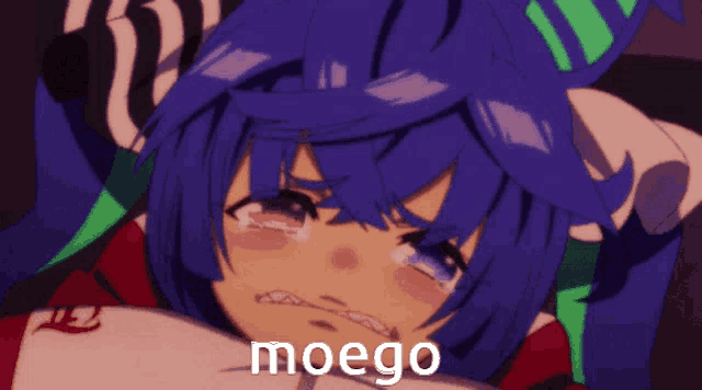 a girl with blue hair is crying and the word moego is visible