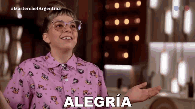 a girl wearing a purple shirt with the word alegria on it